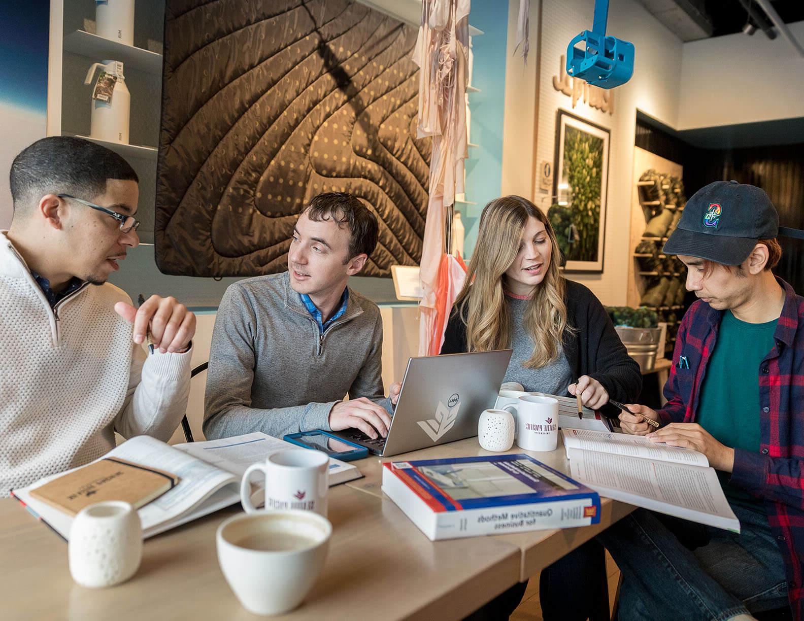 SPU business graduate students work on a group project | Photo by Dan Sheehan